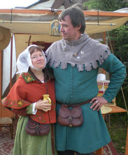 Load image into Gallery viewer, A model shows a medieval men's cotehardie made with our sewing pattern RH022, 14th century man's cotehardie